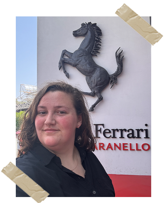 A selfie of me in front of the Ferrari museum sign.